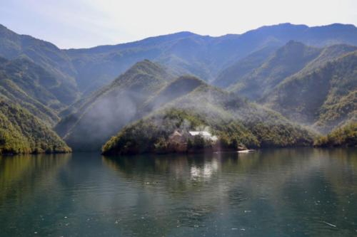 Village in the fog on the Koman Lake